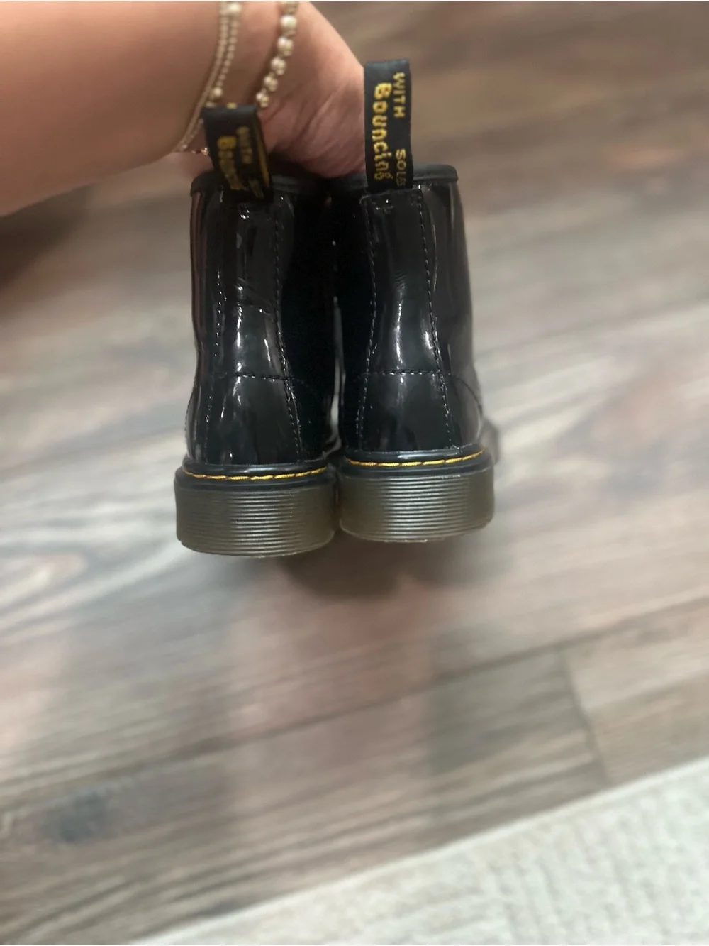 Dr. Martens Kids Black Patent Lace-Up Combat Boots with Yellow Heel Loop
